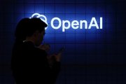 Visitor look at their phone next to an Open AI's logo