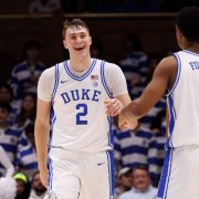 Duke's Cooper Flagg (2) smiles after dunking during the second half of an NCAA college basketball game against California in Durham, N.C.