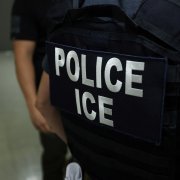 An agent of Immigration and Customs Enforcement (ICE) waits in a hallway outside of a courtroom at New York Federal Plaza Immigration Court inside the Jacob K. Javitz Federal Building in New York on July 17, 2025. US President Donald Trump has made deporting undocumented immigrants a key priority for his second term, after successfully campaigning against an alleged 