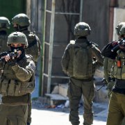 Israeli soldiers patrol a street during a military operation in the Askar refugee camp in eastern Nablus, Israeli-occupied West Bank, on March 2, 2026. (Photo by Jaafar ASHTIYEH / AFP)