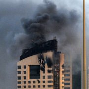 Smoke rises from a high-rise building following a drone attack in Kuwait City