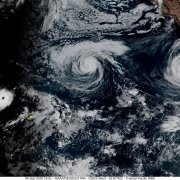 This handout satellite image obtained from the National Oceanic and Atmospheric Administration (NOAA)/GOES shows Hurricane Lowell (L).
