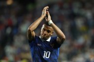 Kylian Mbappé celebra la victoria de Francia.