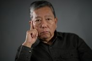 (FILES) Hong Kong pro-democracy activist Lee Cheuk-yan poses during a photo session in Hong Kong on March 21, 2021. Two activists who organised annual vigils marking China's deadly Tiananmen crackdown in 1989 were found guilty of 