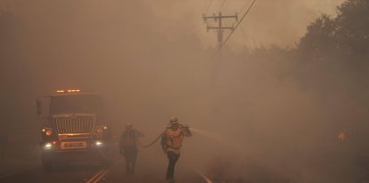Firefighter battle the Canyon Fire on Thursday, Aug. 7, 2025, in Halsey Canyon, Calif.