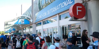 Attendees line up outside the San Diego Convention Center on the first day of Comic-Con International in San Diego, California, on July 24, 2024. (Photo by Chris DELMAS / AFP)