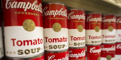 Cans of Campbell's Tomato Soup are seen in a supermarket in New York on Thursday, November 21, 2013. The Campbell Soup Co. announced it would reorganize its business into product divisions as opposed to brands or geographically. Soup sales are decreasing and the company is branching into other products.