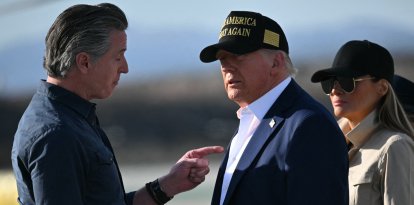 US President Donald Trump and First Lady Melania Trump are greeted by California Governor Gavin Newsom upon arrival at Los Angeles International Airport in Los Angeles, California, on January 24, 2025, to visit the region devastated by the Palisades and Eaton fires. (Photo by Mandel NGAN / AFP)