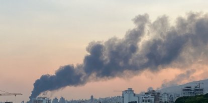 Smoke billows from an explosion at the Islamic Republic of Iran Broadcasting (IRIB) building in Tehran