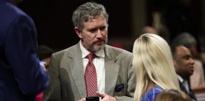 Rep. Thomas Massie (R-KY) talks to Rep. Marjorie Taylor Greene (R-GA)