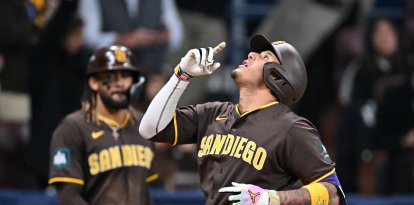 Manny Machado celebra después de su grand slam