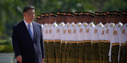 Chinese President Xi Jinping inspects honour guards during a welcoming ceremony at the National Palace in Kuala Lumpur on April 16, 2025. (Photo by Vincent Thian / POOL / AFP)