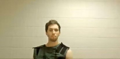 This screengrab from the Utah Court live streaming shows Tyler Robinson, the suspect in the killing of political activist Charlie Kirk, attending a court appearance remotely from his jail cell in Provo, Utah, on September 16, 2025. Robinson has been formally charged with the murder of Kirk, and the prosecution added a notice of intent to seek the death penalty. Six other charges include obstruction of justice and witness tampering. Kirk, a close ally of President Donald Trump, was shot dead last week during a speaking event on a Utah university campus. (Photo by POOL / AFP)