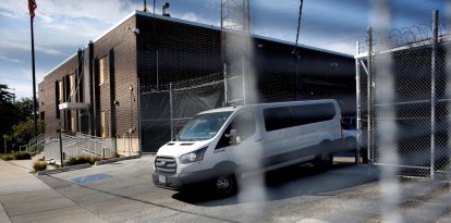 A van exits the Broadview Immigration and Customs Enforcement (ICE) facility amid heightened federal security following US President Donald Trumps order to expand federal presence and intensify immigration enforcement in Chicago through the Department of Homeland Security in Broadview, Illinois, on October 2, 2025. US President Donald Trump, who campaigned on a pledge to deport large numbers of migrants, has encouraged authorities to be more aggressive as he seeks to hit his widely reported target of one million deportations annually. (Photo by OCTAVIO JONES / AFP)