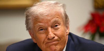 US President Donald Trump reacts during a roundtable discussion in the Roosevelt Room of the White House in Washington, DC, on December 10, 2025. (Photo by ANDREW CABALLERO-REYNOLDS / AFP)
