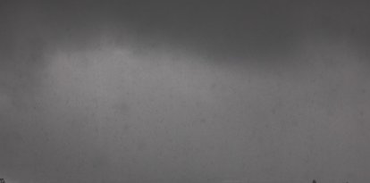 Heavy rain is seen from Kenneth Hahn Park blocking the view of the city skyline on December 24, 2025 in Los Angeles, California. A major winter storm rolled into California on December 23, forcing hundreds of evacuations in burn areas while threatening flooding and travel delays through Christmas for much of the state, officials said.
A "strong atmospheric river brings heavy rain, snow, and wind to California through Friday," the National Weather Service said in a statement on December 23, warning anyone in northern, central and southern parts of the state to "exercise extreme caution." (Photo by Apu GOMES / AFP)