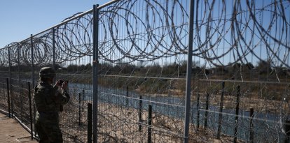 A US Army soldier monitors the US-Mexico border in Eagle Pass, Texas, on January 24, 2025. US President Donald Trump ordered 1,500 more active military personnel to the border with Mexico as part of a flurry of steps to tackle immigration, his spokeswoman said on January 22. Border security is a key priority for the president, who declared a national emergency at the US frontier with Mexico on his first day in office, and the additional personnel will bring the total number of active-duty troops deployed there to around 4,000. (Photo by CHARLY TRIBALLEAU / AFP)