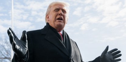 US President Donald Trump speaks to the media as he walks to Marine One prior to departure from the South Lawn of the White House in Washington, DC, January 27, 2026, as he travels to Iowa. President Trump is on his way to Clive, Iowa to deliver a speech on the economy and energy. (Photo by SAUL LOEB / AFP)