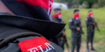 National Liberation Army ELN rebels of the Manuel Vazquez Castano northeastern war front stand guard at Catatumbo region, Colombia on March 8, 2025. Commanders from Colombia's National Liberation Army guerrilla group have vowed to repel a government counteroffensive in the country's northeast, warning years of "total peace" risk turning into "total war".  (Photo by AFP)