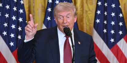 US President Donald Trump speaks at a "Champion of Coal" event at the White House in Washington, DC, on February 11, 2026. (Photo by SAUL LOEB / AFP)