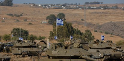 Israeli Merkava tanks are positioned in the upper Galilee in northern Israel near the border with Lebanon (Files)