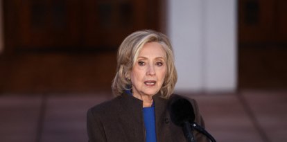Former US Secretary of State Hillary Clinton speaks to the press after her a deposition with the House Oversight Committee as they investigate links to convicted sex offender Jeffrey Epstein, in Chappaqua, New York, on February 26, 2026. Clinton testified behind closed doors on Thursday before a congressional committee investigating the late convicted sex offender Jeffrey Epstein and his accomplice Ghislaine Maxwell. Former president Bill Clinton is scheduled to answer questions the following day from the Republican-led House Oversight Committee about his relations with Epstein, who died in a New York jail cell in 2019 while awaiting trial. (Photo by CHARLY TRIBALLEAU / AFP)