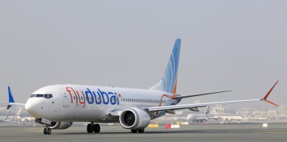 A Fly Dubai Boeing 737 Max taxis at Dubai International Airport in Dubai