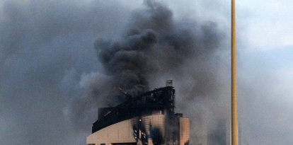 Smoke rises from a high-rise building following a drone attack in Kuwait City