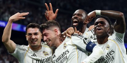 Real Madrid's Uruguayan midfielder #08 Federico Valverde (2L) celebrates his third goal during the UEFA Champions League last 16 first leg football match between Real Madrid CF and Manchester City at Santiago Bernabeu Stadium in Madrid on March 11, 2026. (Photo by Pierre-Philippe MARCOU / AFP)