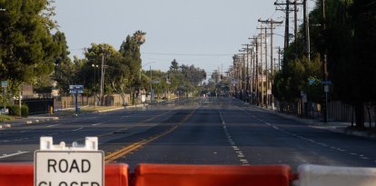 Roads remain closed after residents were evacuated following a chemical leak from a large storage tank that threatened nearby homes in Garden Grove, California, on May 24, 2026. Authorities in California on May 24 said they discovered a crack in a damaged tank of toxic chemicals, potentially relieving pressure as the threat of an explosion has forced tens of thousands of residents to evacuate. About 50,000 residents were ordered to leave their homes in the Garden Grove area of Orange County, southeast of Los Angeles, on Friday after the tank began to leak, sending fumes over a heavily populated area about five miles from Disneyland. (Photo by Blake Fagan / AFP)