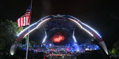 Fireworks go off as America's Justin Gaethje celebrates after defeating Georgia's Ilia Topuria during "UFC Freedom 250"