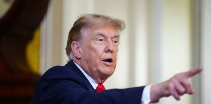US President Donald Trump speaks to the press after a lunch meeting with Senate Republicans at the US Capitol in Washington, DC, on June 24, 2026. President Trump said Wednesday he will refuse to sign a landmark housing bill, passed by Congress with broad bipartisan support, until lawmakers approve legislation that would overhaul American elections and restrict voter registration. (Photo by Aaron Schwartz / AFP)