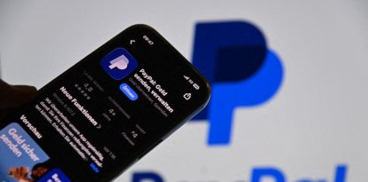 Offer available: Paypal is apparently up for sale. A smartphone displays the PayPal app in the App Store in front of a blurry monitor with the PayPal logo ?SVEN SIMON Photo Agency GmbH & Co. Press Photo KG # Seidlhofstr.10 # 85540 Haar # GLS Bank IBAN (Photo by Frank Hoermann / SVEN SIMON / SVEN SIMON / dpa Picture-Alliance via AFP)