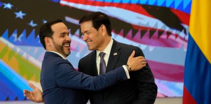 Colombia's President Abelardo de la Espriella (L) and US Secretary of State Marco Rubio (R) embrace during a bilateral agreements signing ceremony in Barranquilla, Colombia on September 8, 2026. (Photo by Fernando Vergara / POOL / AFP)