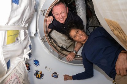 This undated handout picture from Nasa released on July2, 2024 shows NASAs Boeing Crew Flight Test astronauts (from top) Butch Wilmore and Suni Williams inside the vestibule between the forward port on the International Space Stations Harmony module and Boeing's Starliner spacecraft. - The first astronauts to fly Boeing's troubled Starliner are definitely not "stranded" at the International Space Station, NASA insisted on June 28, 2024 despite having no clear timeframe for bringing them home. In an unusually defensive press call, officials attempted to put a positive spin on where things currently stood after weeks of negative headlines due to the spaceship's delayed return. (Photo by Handout / NASA / AFP) / RESTRICTED TO EDITORIAL USE - MANDATORY CREDIT "AFP PHOTO / NASA" - NO MARKETING NO ADVERTISING CAMPAIGNS - DISTRIBUTED AS A SERVICE TO CLIENTS