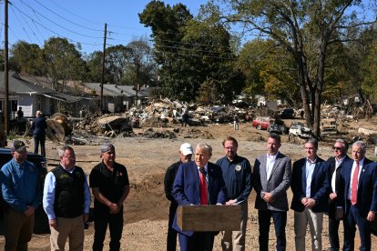 Former US President and Republican presidential candidate Donald Trump speaks to the media in Swannanoa, North Carolina, on October 21, 2024, after observing cleanup efforts in the aftermath of Hurricane Helene, which devastated the region. (Photo by Jim WATSON / AFP)