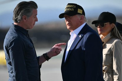US President Donald Trump and First Lady Melania Trump are greeted by California Governor Gavin Newsom upon arrival at Los Angeles International Airport in Los Angeles, California, on January 24, 2025, to visit the region devastated by the Palisades and Eaton fires. (Photo by Mandel NGAN / AFP)