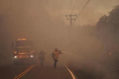 Firefighter battle the Canyon Fire on Thursday, Aug. 7, 2025, in Halsey Canyon, Calif.