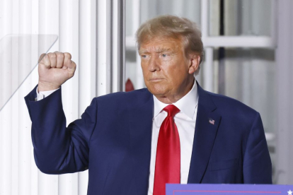 Doanld Trump raises a fist.