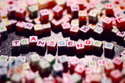 Letters from a children's game forming the word "Transgender".