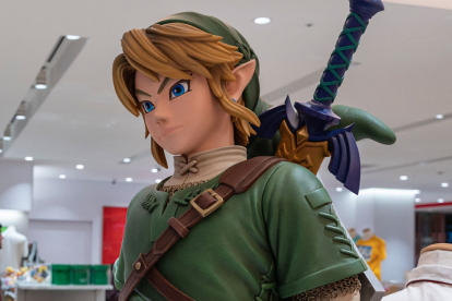 This photo taken on May 8, 2023 shows a display (R) for Japanese gaming giant Nintendo's long-running "Legend of Zelda" game series, at the company's official store in Tokyo's Shibuya district. Nintendo, who will report net annual earnings later on May 9, will also release the latest instalment in its long-running "Legend of Zelda" game series, titled "Tears of the Kingdom", for the Switch on May 12. (Photo by Richard A. Brooks / AFP)