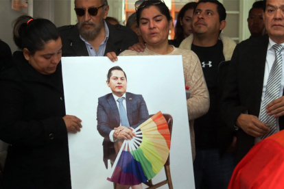 Relatives of Jesus Ociel Baena, Mexico's first openly non-binary magistrate, attend a posthumous tribute at the Electoral Court of the State of Aguascalientes, in Aguascalientes, Mexico, on November 14, 2023. Baena, whose death sparked protests and anger among the LGBTQ community, appears to have been the victim of a murder-suicide committed by their partner, investigators said Tuesday. Despite prosecutors ruling out the presence of a third person at the scene, protesters gathered in Mexico City insisting Baena -- the first Mexican citizen to be granted a non-binary passport -- was the victim of a hate crime. (Photo by AFP)