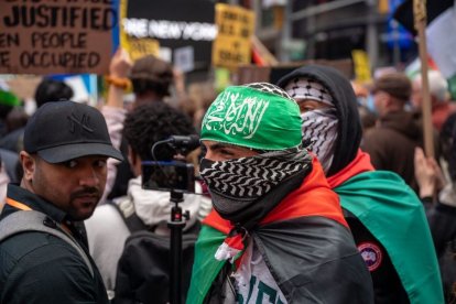 Individuals gather in Times Square and march to the Israeli Consulate to express support for the Palestinian people and Hamas's current attack on the state of Israel on October 8, 2023 in New York, NY. ()