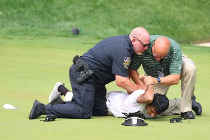 CROMWELL, CT - JUNE 23: Protesters are arrested after running onto the 18th green during the final round of the 2024 Travelers Championship on June 23, 2024, at TPC River Highlands in Cromwell, CT. (Credit Image: © Mingo Nesmith/Icon SMI via ZUMA Press)