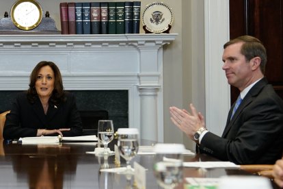 (FILES)  Kentucky Governor Andy Beshear (R) looks on as US Vice President Kamala Harris speaks during a roundtable conversation about marijuana reform and criminal justice reform, in the Roosevelt Room of the White House on March 15, 2024 in Washington, DC. - US President Joe Biden announced July 21, 2024 that he is dropping out of his reelection battle with Donald Trump, in a historic move that plunges the already turbulent 2024 White House race into uncharted territory. Biden's withdrawal from the race for the White House leaves a gap atop the Democratic presidential ticket that the party. (Photo by Kent Nishimura / AFP)