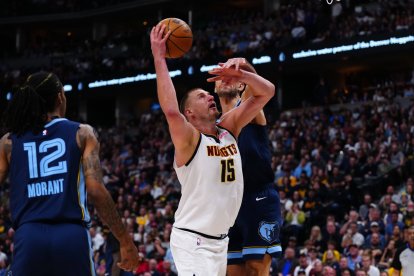 Apr 11, 2025; Denver, Colorado, USA; Memphis Grizzlies forward Santi Aldama (7) defends on Denver Nuggets center Nikola Jokic (15) in the second half at Ball Arena. Mandatory Credit: Ron Chenoy-Imagn Images/Sipa USA *** Local Caption *** 60728164