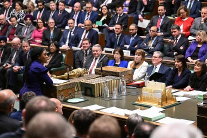 Keir Starmer listening to main opposition Conservative Party leader Kemi Badenoch