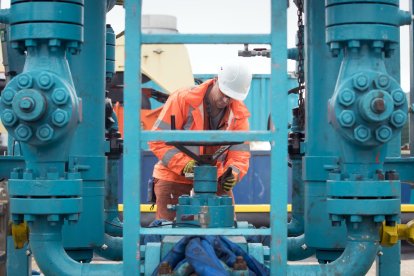 File photo dated 05/10/18 of a worker at the Cuadrilla fracking site in Preston New Road, Little Plumpton, Lancashire, as Labour has pledged to ban fracking "once and for all" as it hit out at suggestions that the Government could move to ban solar farms from much of England's farmland.