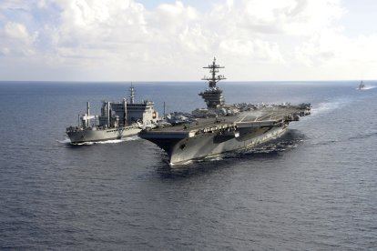 In this October 18, 2015 US Navy handout photo,The aircraft carrier USS Theodore Roosevelt (CVN 71) pulls alongside the Indian Deepak-class fleet tanker INS Shakti (A 57) during a replenishment-at-sea exercise as a part of Exercise Malabar 2015. Malabar is a continuing series of complex, high-end war fighting exercises conducted to advance multi-national maritime relationships and mutual security. AFP PHOTO / HANDOUT  / US NAVY / MCS CHAD M. TRUDEAU           == RESTRICTED TO EDITORIAL USE / MANDATORY CREDIT: "AFP PHOTO / HANDOUT / US NAVY / MCS CHAD M. TRUDEAU  "/ NO MARKETING / NO ADVERTISING CAMPAIGNS / DISTRIBUTED AS A SERVICE TO CLIENTS == (Photo by MCS CHAD M. TRUDEAU / US NAVY / AFP)
