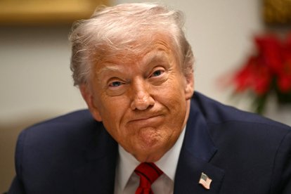 US President Donald Trump reacts during a roundtable discussion in the Roosevelt Room of the White House in Washington, DC, on December 10, 2025. (Photo by ANDREW CABALLERO-REYNOLDS / AFP)